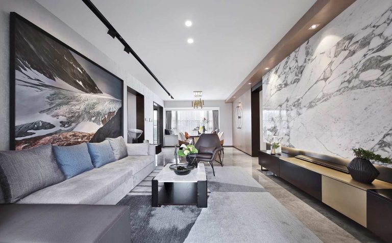 Modern living room with a marble feature wall and built-in media cabinetry